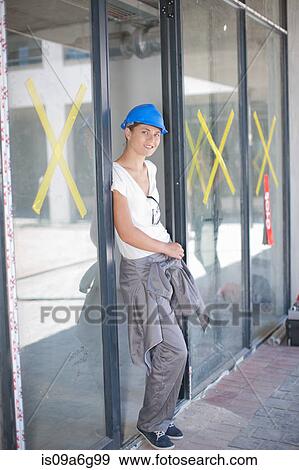 Portrait of female construction worker on construction site View Large Photo Image Stock Photo - Portrait of female construction worker on construction site. Fotosearch