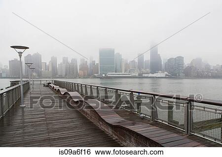 Promenade and East River, New York City, USA View Large Photo Image Stock Photograph - Promenade and East River, New York City, USA. Fotosearch