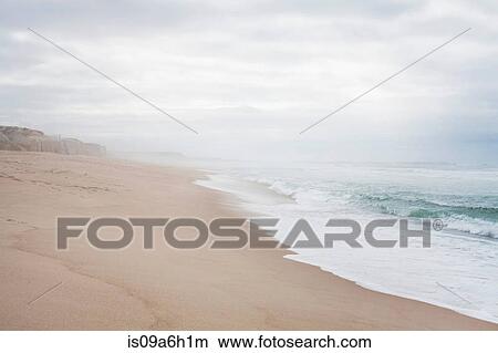 Quiet beach scene with misty horizon View Large Photo Image Picture - Quiet beach scene with misty horizon. Fotosearch