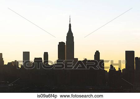 Stock Photography - Silhouette of Empire State Building and skyline, New York City, USA. Fotosearch