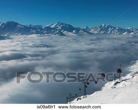 Ski lifts in ski resort with low cloud View Large Photo Image Stock Image - Ski lifts in ski resort with low cloud. Fotosearch