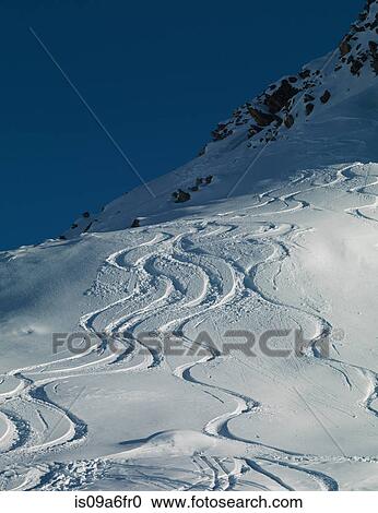 Ski tracks in snow on mountain View Large Photo Image Stock Image - Ski tracks in snow on mountain. Fotosearch