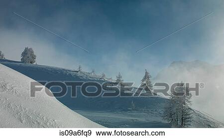 Snow on mountains with low cloud View Large Photo Image Stock Photo - Snow on mountains with low cloud. Fotosearch