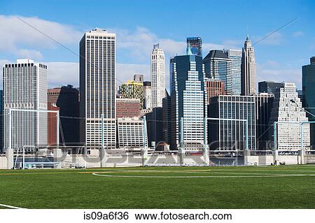 Stock Photograph - Soccer fields and Lower Manhattan skyline, New York City, USA. Fotosearch