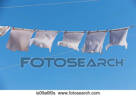 Stock Photograph - T shirts on clothes line. Fotosearch