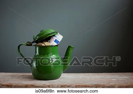 Teapot with Euros inside View Large Photo Image Picture - Teapot with Euros inside. Fotosearch