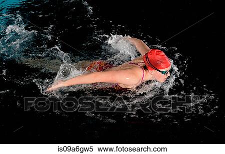 Teenage girl doing butterfly stroke in swimming pool View Large Photo Image Stock Photography - Teenage girl doing butterfly stroke in swimming pool. Fotosearch
