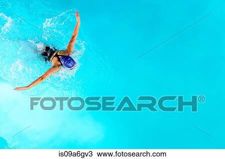 Teenage girl swimming in swimming pool View Large Photo Image Stock Image - Teenage girl swimming in swimming pool. Fotosearch
