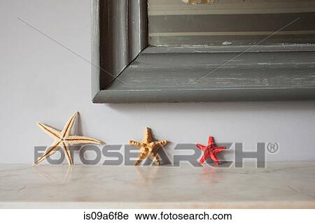 Three starfish on mantelpiece View Large Photo Image Stock Image - Three starfish on mantelpiece. Fotosearch