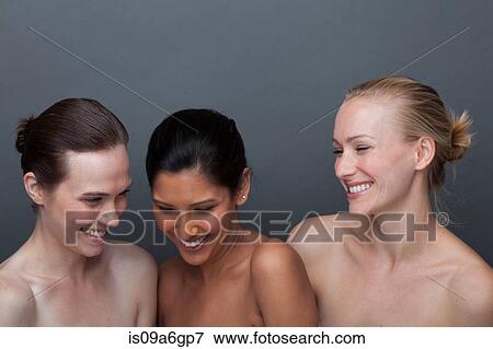 Three young woman laughing View Large Photo Image Stock Photo - Three young woman laughing. Fotosearch