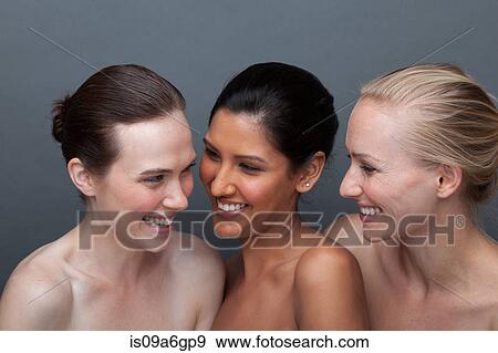 Three young woman laughing View Large Photo Image Stock Photo - Three young woman laughing. Fotosearch