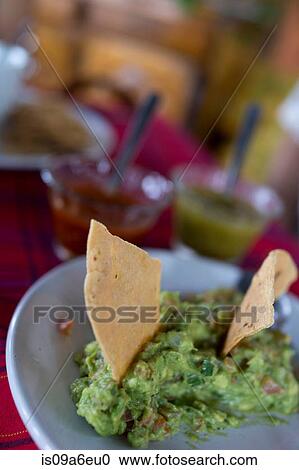 Tortilla chips and guacamole View Large Photo Image Stock Image - Tortilla chips and guacamole. Fotosearch