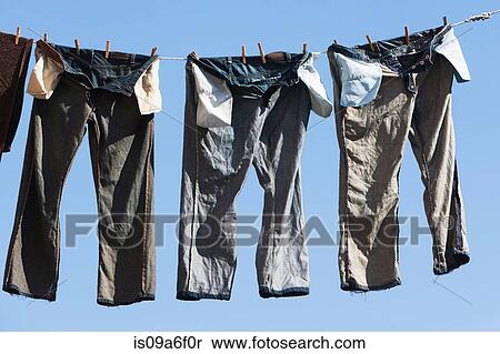 Trousers on clothes line View Large Photo Image Stock Photography - Trousers on clothes line. Fotosearch