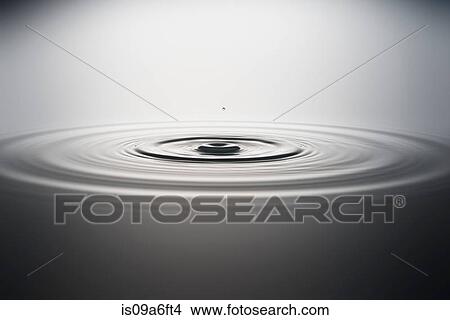 Water droplet falling into water View Large Photo Image Picture - Water droplet falling into water. Fotosearch