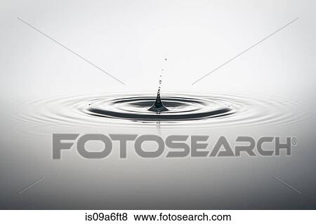 Stock Photo - Water droplet falling into water. Fotosearch