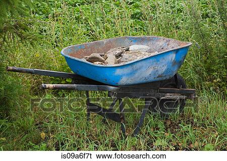 Wheelbarrow with rocks View Large Photo Image Stock Photograph - Wheelbarrow with rocks. Fotosearch