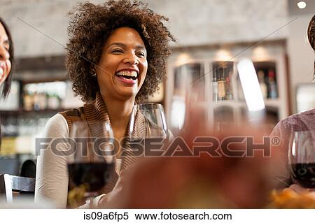 Woman at restaurant laughing View Large Photo Image Stock Photography - Woman at restaurant laughing. Fotosearch