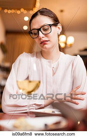 Stock Photo - Woman having a drink. Fotosearch