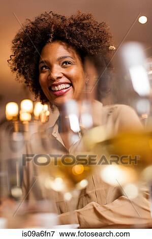 Stock Photo - Woman having a drink. Fotosearch