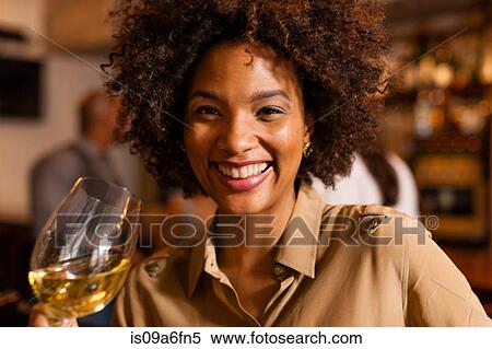 Woman having a drink View Large Photo Image Stock Photography - Woman having a drink. Fotosearch