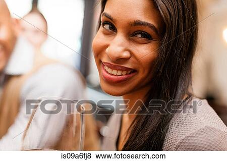 Stock Photo - Woman smiling coyly. Fotosearch