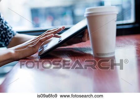 Woman using digital tablet View Large Photo Image Stock Photo - Woman using digital tablet. Fotosearch