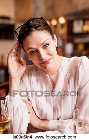Woman with spectacles on head View Large Photo Image Picture - Woman with spectacles on head. Fotosearch