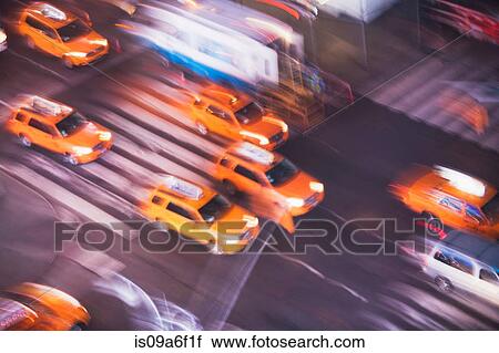 Stock Image - Yellow taxi cabs, New York City, USA. Fotosearch