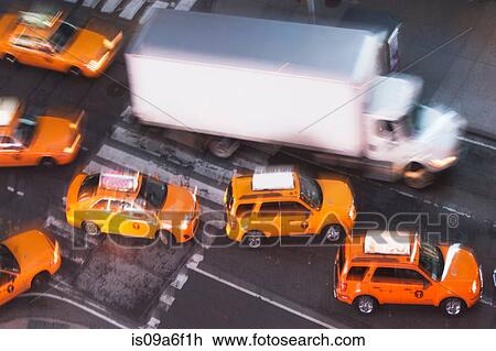 Stock Image - Yellow taxi cabs, New York City, USA. Fotosearch