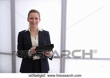 Young businesswoman using digital tablet View Large Photo Image Stock Image - Young businesswoman using digital tablet. Fotosearch