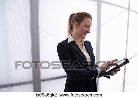 Young businesswoman using digital tablet View Large Photo Image Stock Image - Young businesswoman using digital tablet. Fotosearch