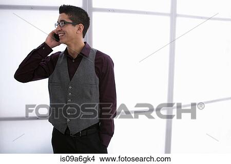 Young man on smartphone View Large Photo Image Picture - Young man on smartphone. Fotosearch