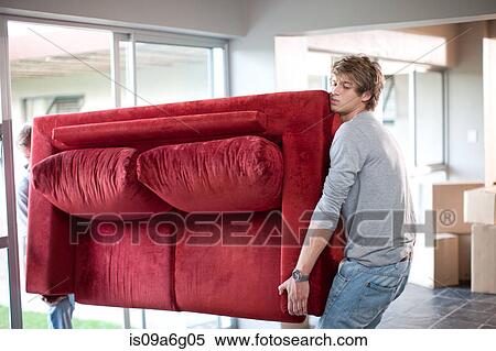 Young men carrying sofa View Large Photo Image Stock Photography - Young men carrying sofa. Fotosearch