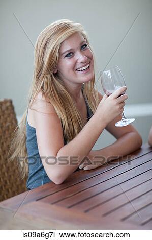 Young woman drinking wine View Large Photo Image Stock Image - Young woman drinking wine. Fotosearch