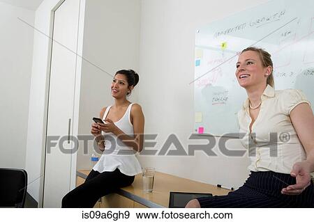 Stock Photo - Young woman in front of whiteboard. Fotosearch