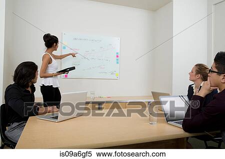 Stock Photography - Young woman using whiteboard. Fotosearch