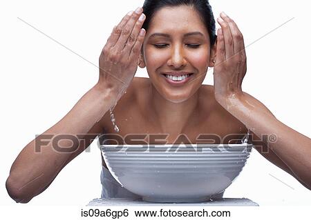 Young woman washing face View Large Photo Image Stock Photograph - Young woman washing face. Fotosearch