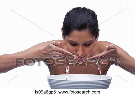 Young woman washing face View Large Photo Image Stock Photography - Young woman washing face. Fotosearch