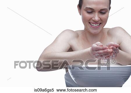 Stock Photography - Young woman with bowl of water. Fotosearch