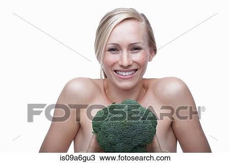 Young woman with broccoli View Large Photo Image Stock Image - Young woman with broccoli. Fotosearch
