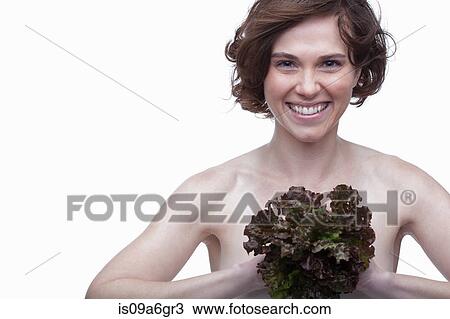 Stock Image - Young woman with lettuce. Fotosearch