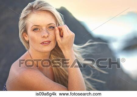 Stock Image - Young woman with long blonde hair. Fotosearch