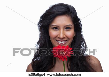 Picture - Young woman with red flower. Fotosearch