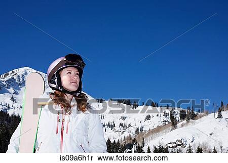 Young woman with snowboard at Brighton ski resort, Utah, USA View Large Photo Image Stock Photography - Young woman with snowboard at Brighton ski resort, Utah, USA. Fotosearch