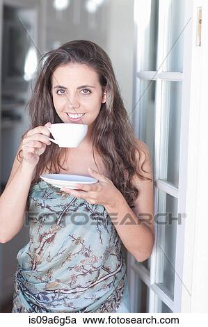 Young women with cup of tea View Large Photo Image Stock Image - Young women with cup of tea. Fotosearch