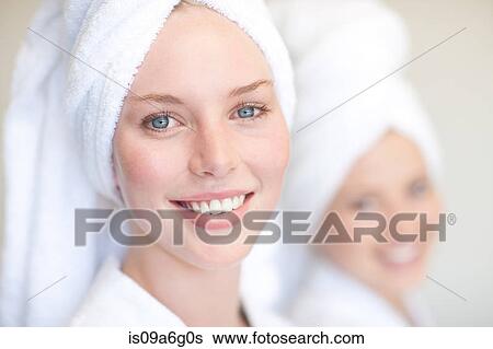 Young women with towels on heads in spa View Large Photo Image Stock Photograph - Young women with towels on heads in spa. Fotosearch