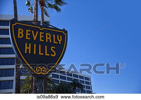 Beverly Hills sign against blue sky View Large Photo Image Stock Photo - Beverly Hills sign against blue sky. Fotosearch