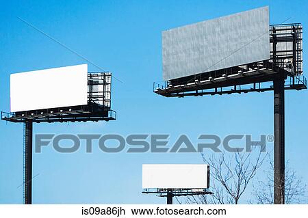 Stock Image - Blank billboards against blue sky. Fotosearch