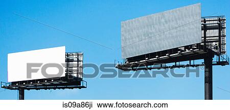 Stock Image - Blank billboards against blue sky. Fotosearch