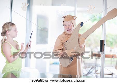 Boy playing the guitar View Large Photo Image Stock Image - Boy playing the guitar. Fotosearch